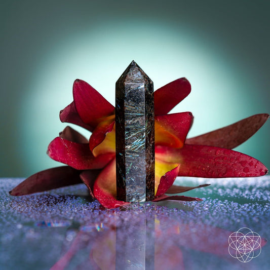 Rare Arfvedsonite crystal point with marble-white streaks through dark stone