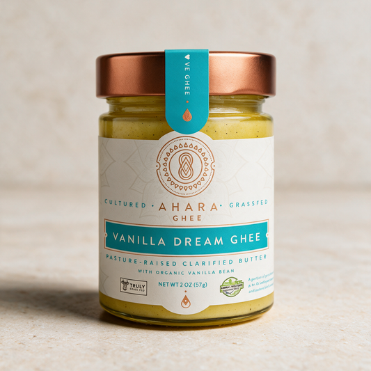 Ahara Rasa Vanilla Dream ghee in the 2 oz jar with a copper lid and pale blue label on a stone surface