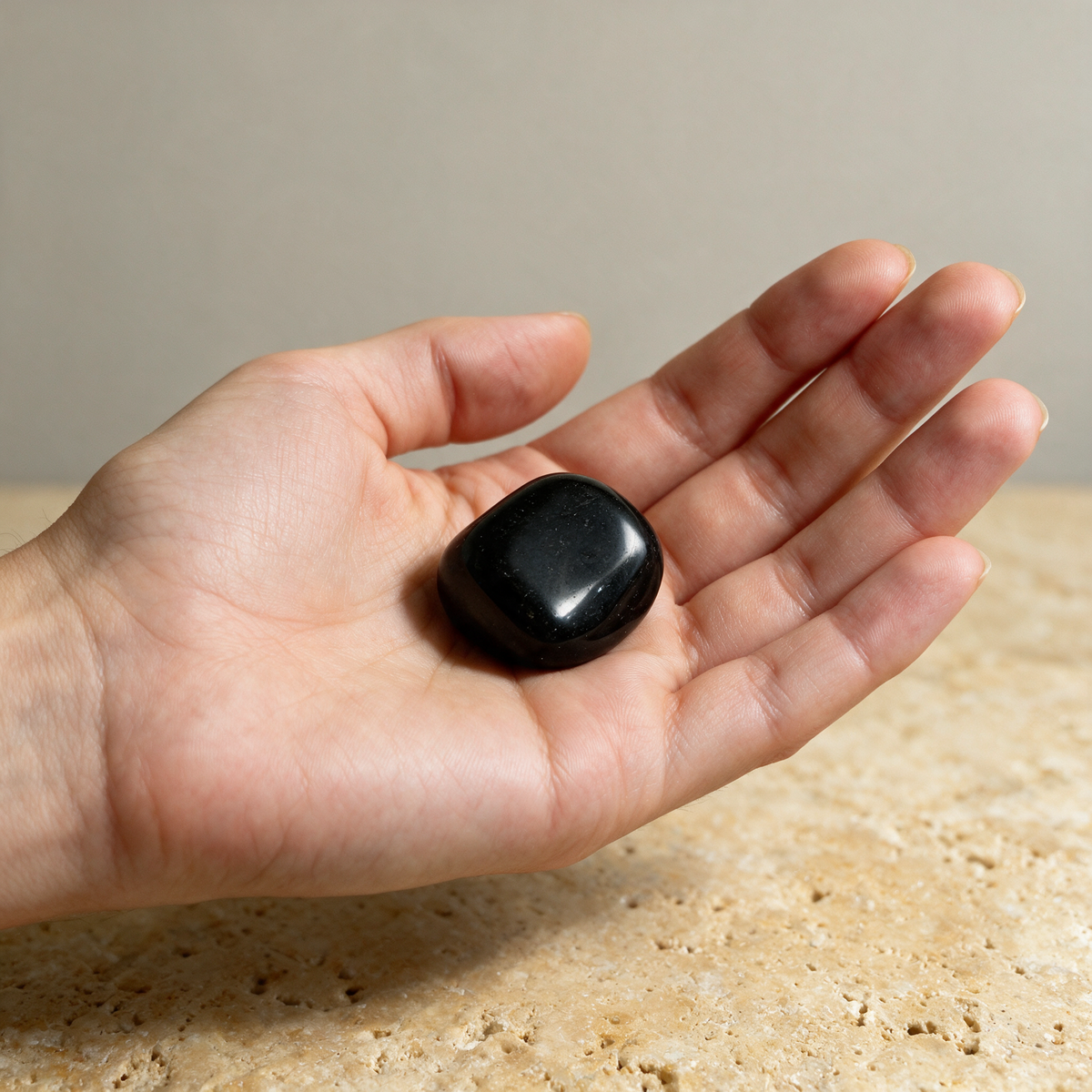 Black Obsidian Tumbled Pocket Stone — Truth, Protection & Shadow Work – scale context