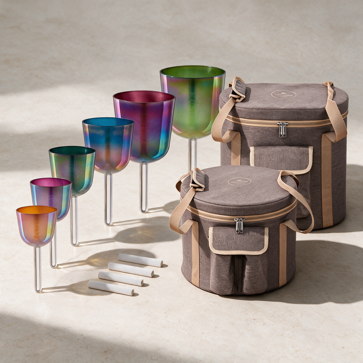 The complete six-bowl Solfeggio set with stems and mallets arranged beside both padded carry bags