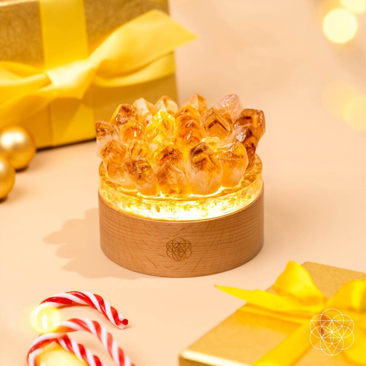Citrine crystal lamp with golden points rising from a wooden base — view 4