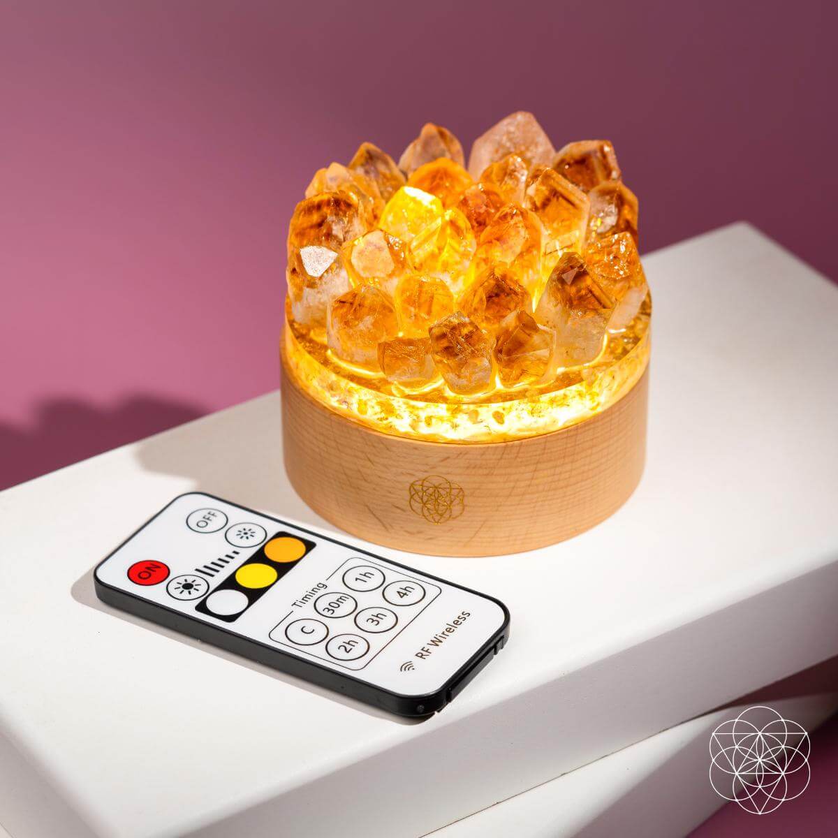 Citrine crystal lamp with golden points rising from a wooden base — view 5