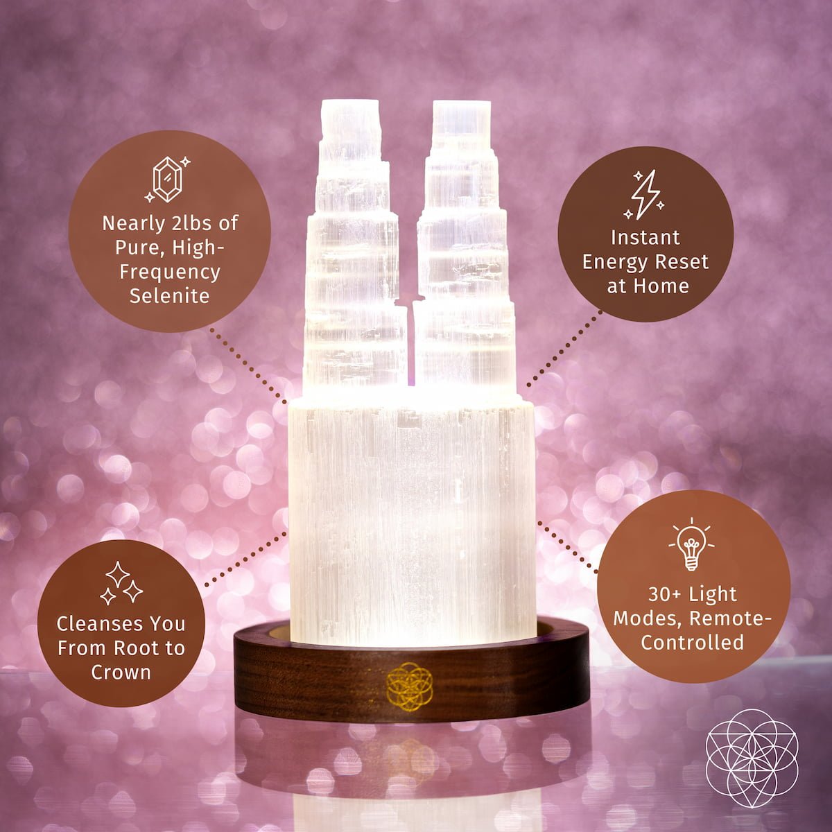 Two carved Selenite towers glowing side by side on a wooden base — view 5