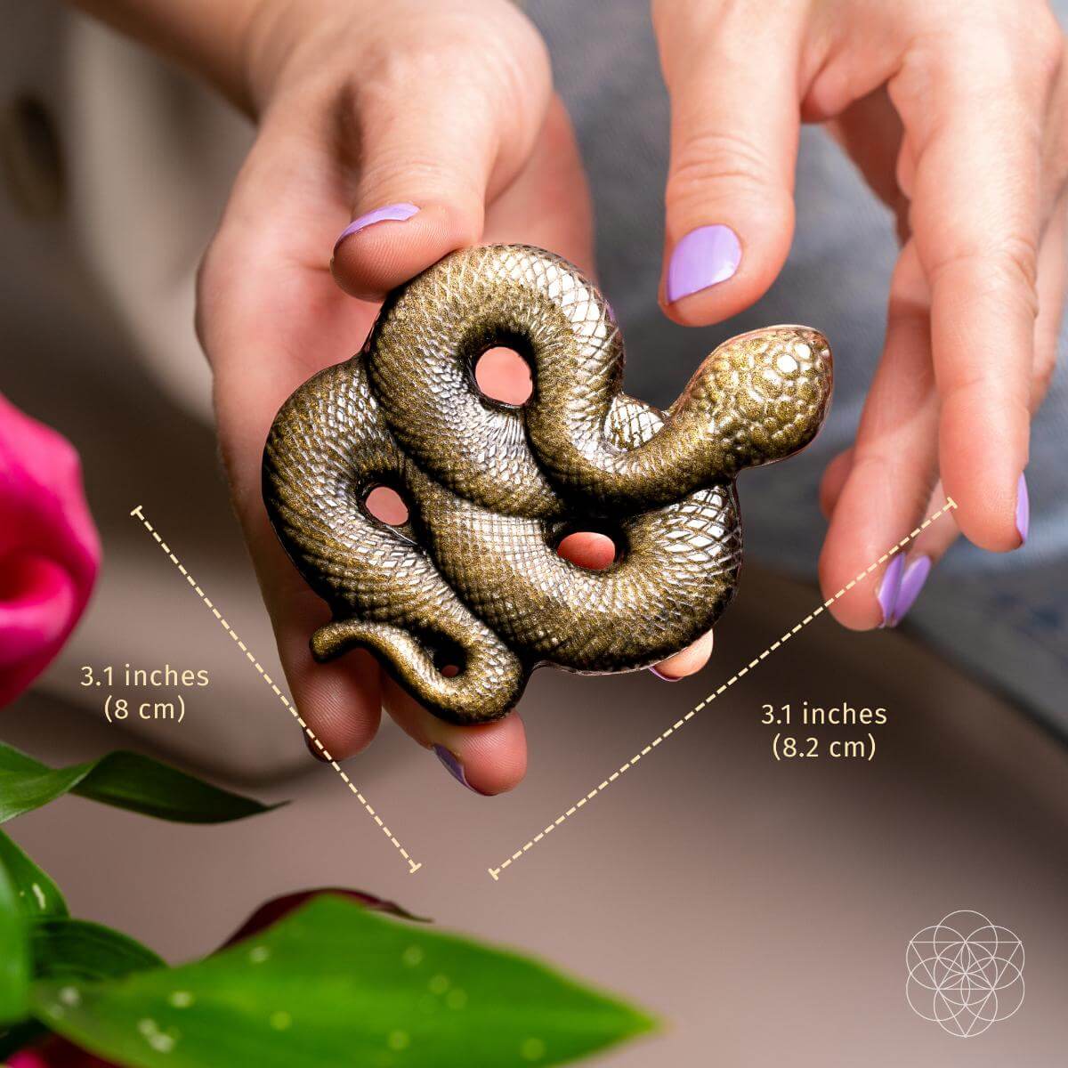 Hand-carved gold sheen obsidian serpent totem, coiled, with a golden shimmer across the black stone — detail view 2