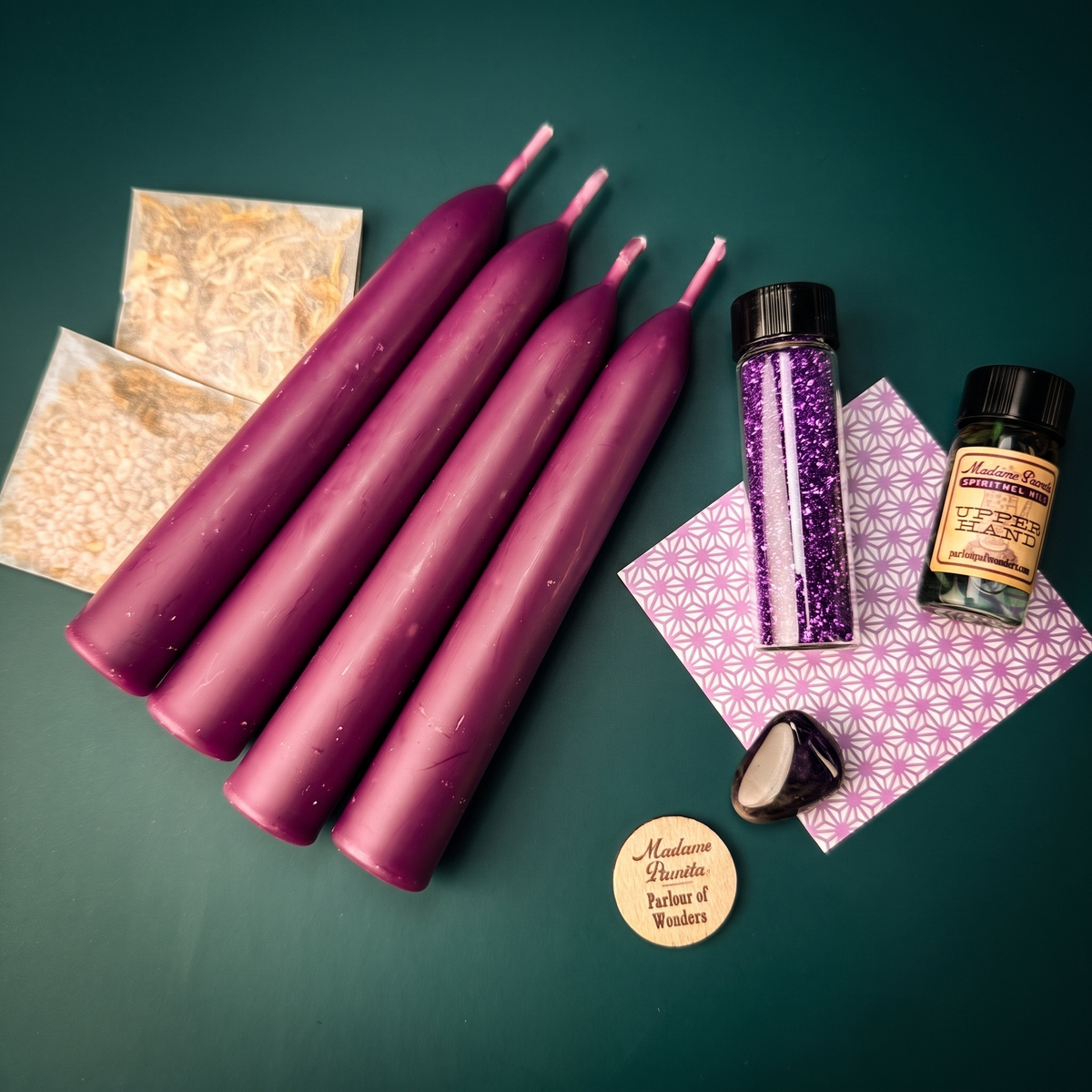 Influence Candle Spell Booster Pack with four purple beeswax taper candles, Upper Hand oil, herbs, a tumbled gemstone and glass glitter