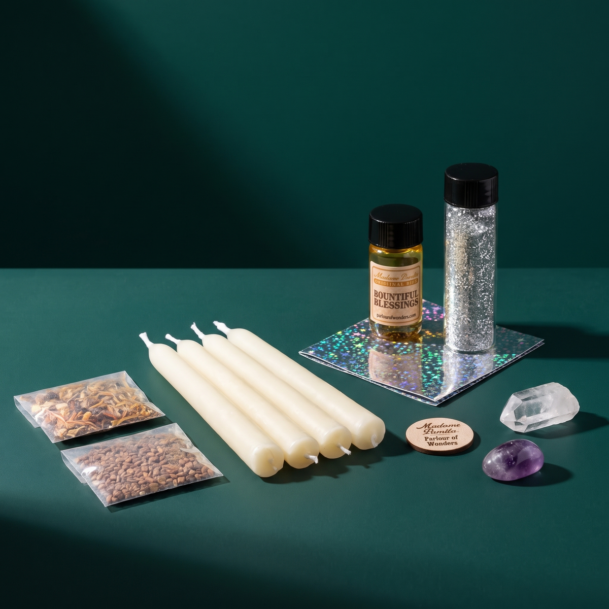 Miracles Candle Spell Booster Pack on deep green: four white beeswax taper candles, a bottle of Bountiful Blessings oil, a vial of silver glass glitter, sealed herb packets and a clear quartz point.