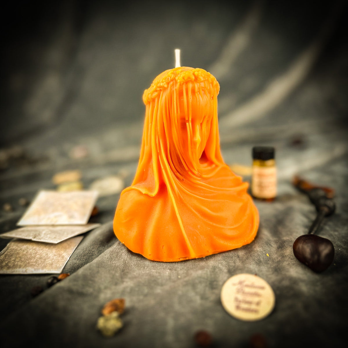 Veil of Secrets beeswax veiled figure candle in orange with the kit oil and instructions