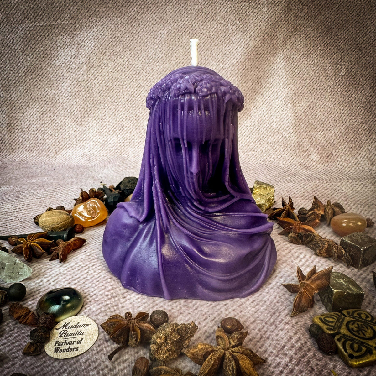 Veil of Secrets beeswax veiled figure candle in purple with herbs and stones
