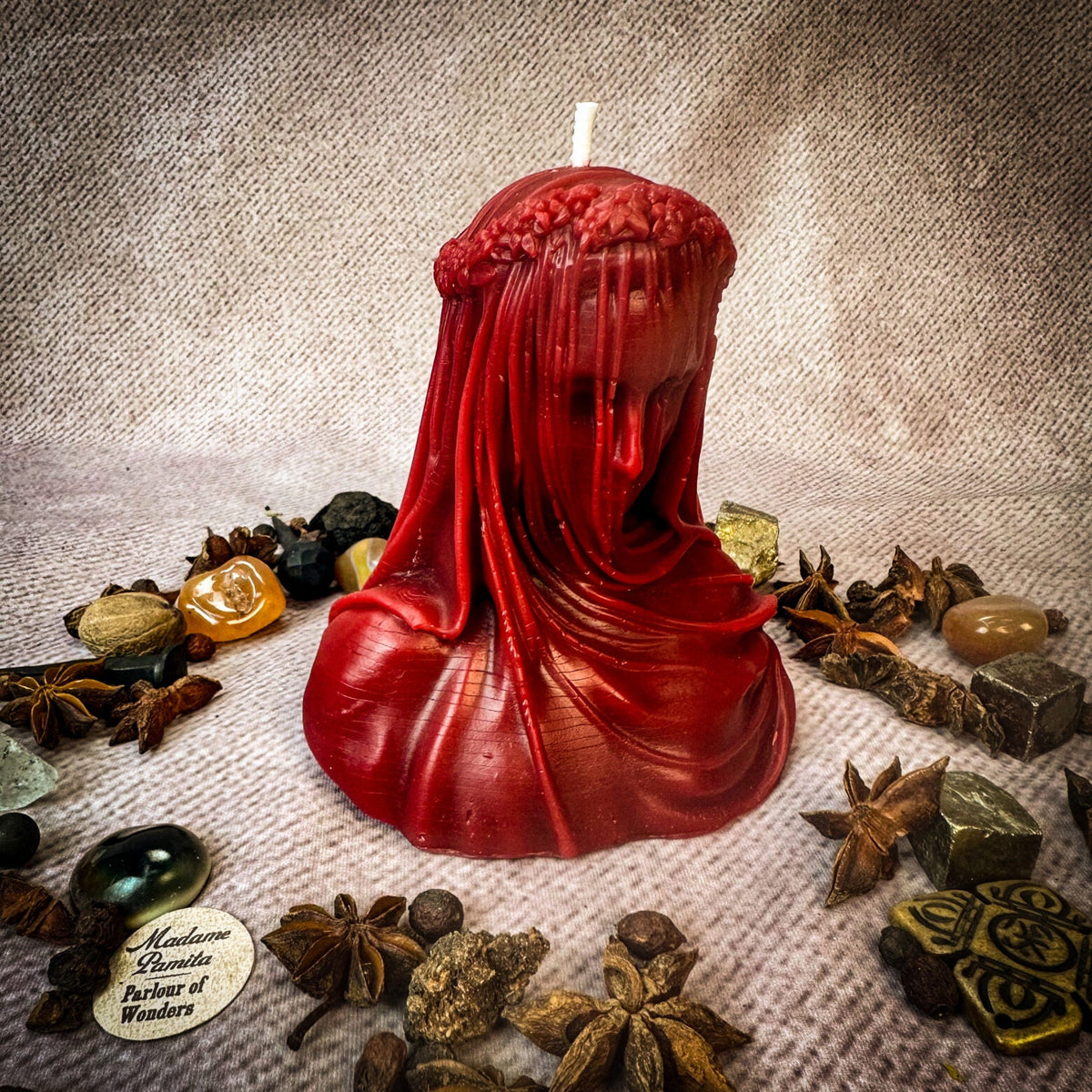 Veil of Secrets beeswax veiled figure candle in red with herbs and stones