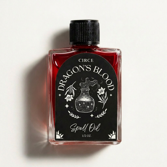 Dragon's Blood ritual oil in a half ounce twist-top glass bottle with resin